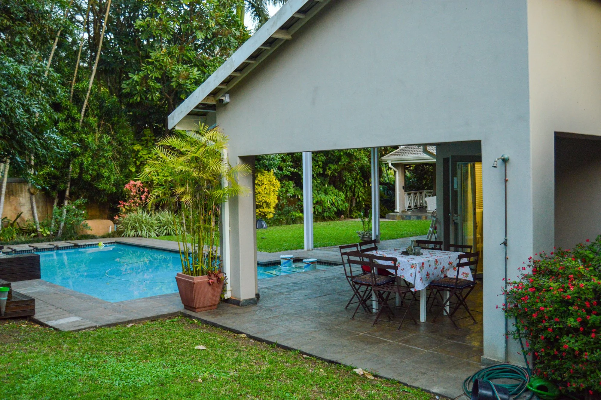 Yellowwoods Bed and Breakfast Empangeni — poolside patio Yellowwoods Bed and Breakfast Empangeni covered patio and outdoor dining table beside the swimming pool