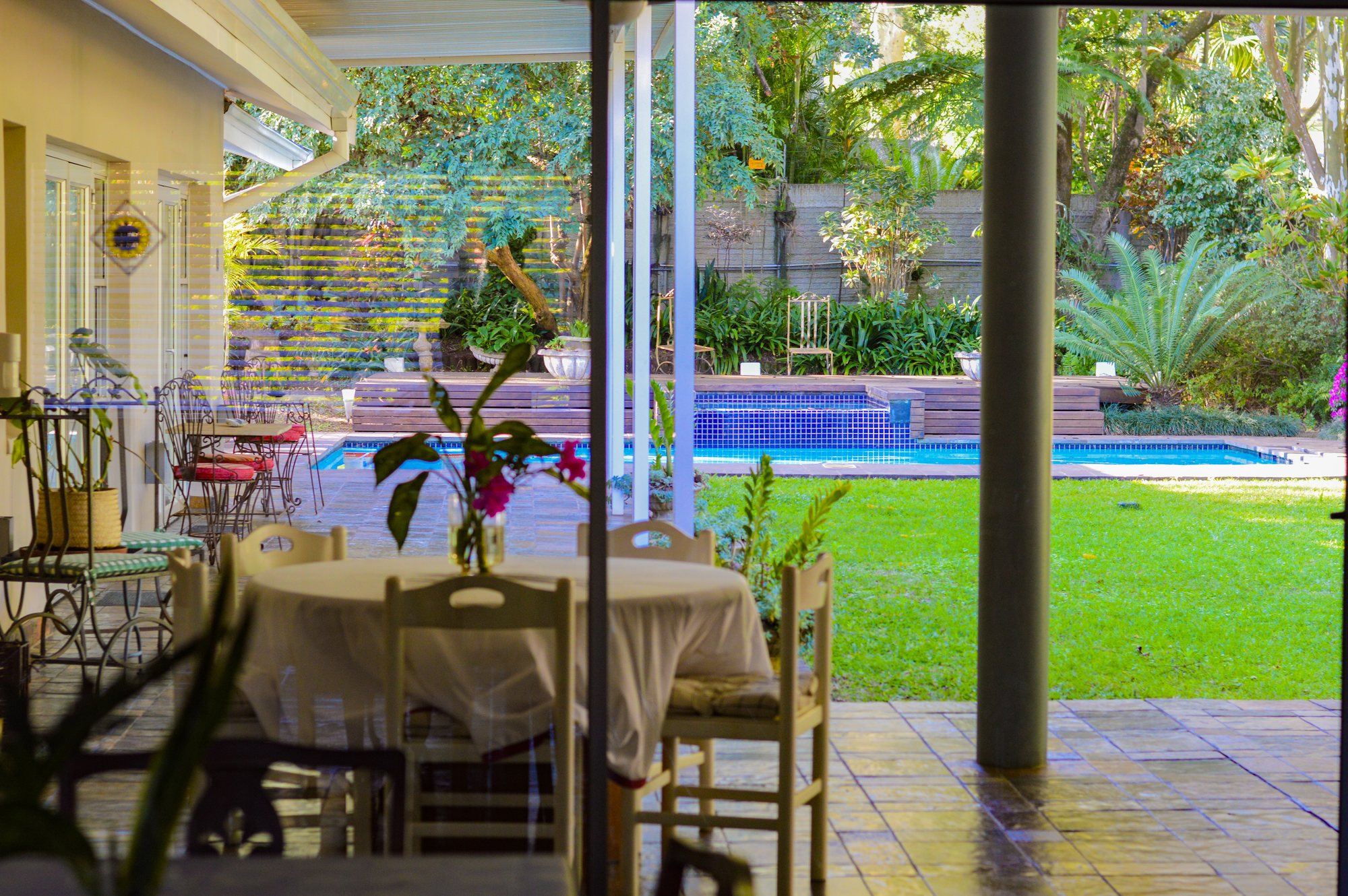 Outdoor table on the Yellowwoods patio surrounded by greenery