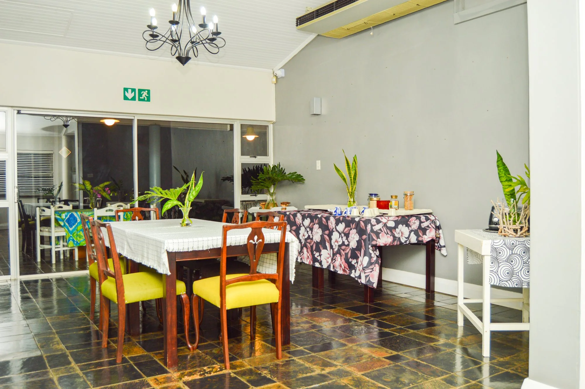 Yellowwoods Bed and Breakfast Empangeni — breakfast room Yellowwoods Bed and Breakfast Empangeni breakfast room laid with linen and fresh flowers