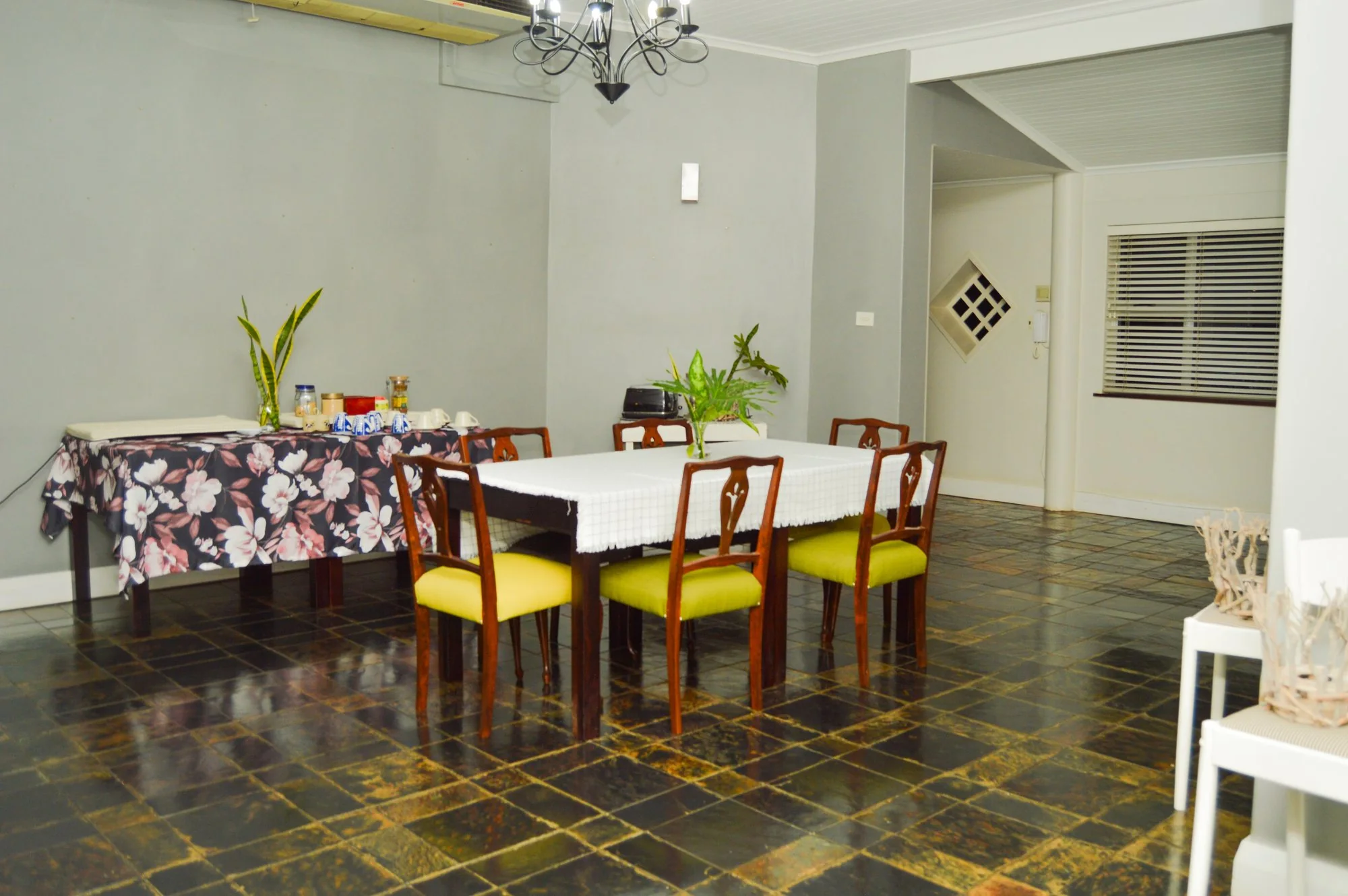 Yellowwoods Bed and Breakfast Empangeni — dining room Yellowwoods Bed and Breakfast Empangeni dining room seen in full, set for the evening
