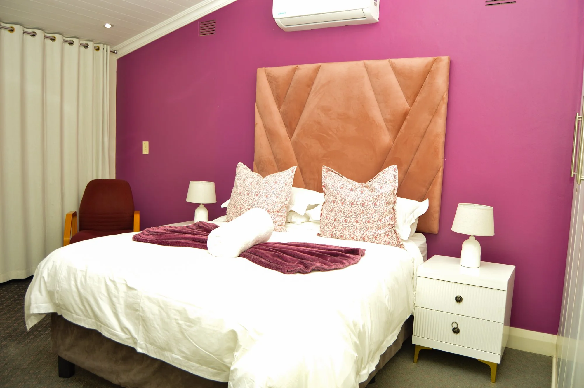 Yellowwoods Bed and Breakfast Empangeni — room four Yellowwoods Bed and Breakfast Empangeni room four with an upholstered headboard and warm bedside lighting