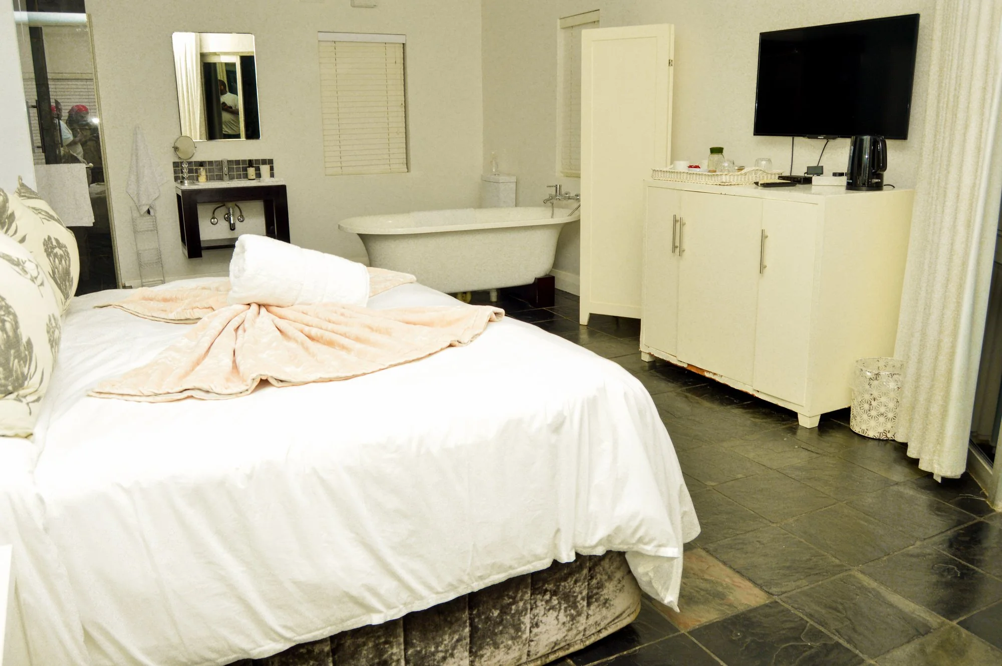Yellowwoods Bed and Breakfast Empangeni — room one Yellowwoods Bed and Breakfast Empangeni room one with a white draped bed and a freestanding bath